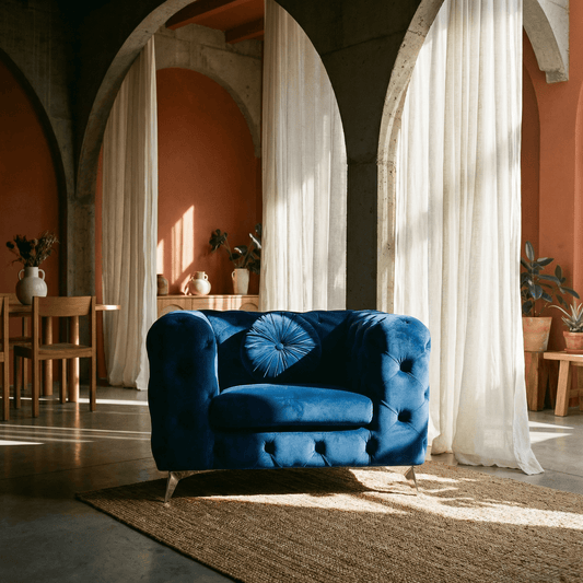 Blue Luxe Deco Tufted Velvet Armchair 41"W in a stylish interior with plush textures and dramatic lighting.