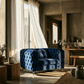 Blue Luxe Deco Tufted Velvet Armchair 41"W in a stylish, modern living room setting with natural light.