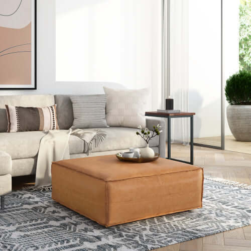 Brody Large Square Faux Leather Ottoman 36" – Coffee Table Ottoman (2 Colors) in a modern living room setting.