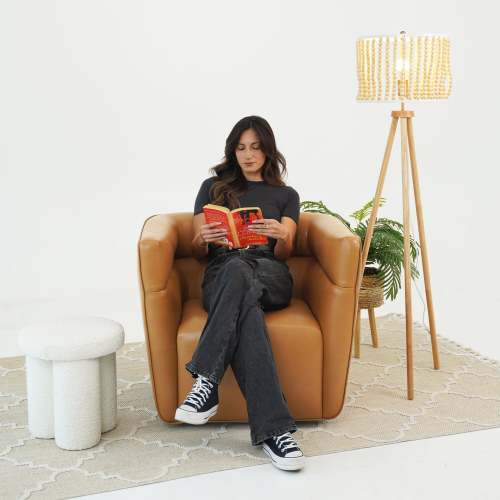 Tan Faux Leather Swivel Chair – Modern Barrel Accent Chair with 360° Swivel (Fully Assembled) in a cozy living room setting.