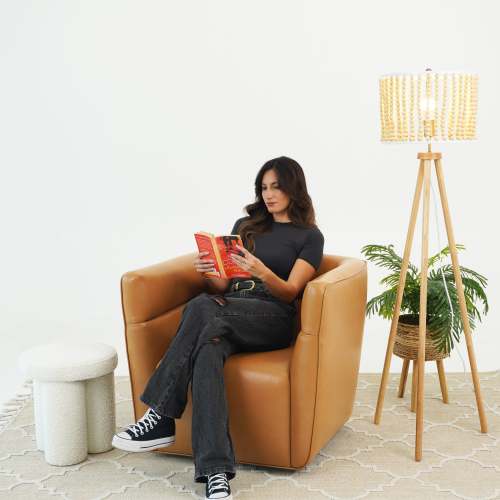 Tan Faux Leather Swivel Chair – in room setting