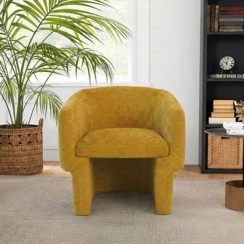 Wichita Chenille Lounge Chair – Modern Curved Accent Chair (Brown or Gold) in yellow with palm and bookshelf.