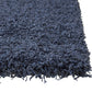 Slate blue rectangular shag area rug corner, showcasing plush texture and deep blue color, perfect for cozy spaces.