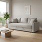 Connie Beige Boucle Sleeper Sectional Sofa – 89” Pull-Out Sofa Bed with Pillows in a modern living room setting.