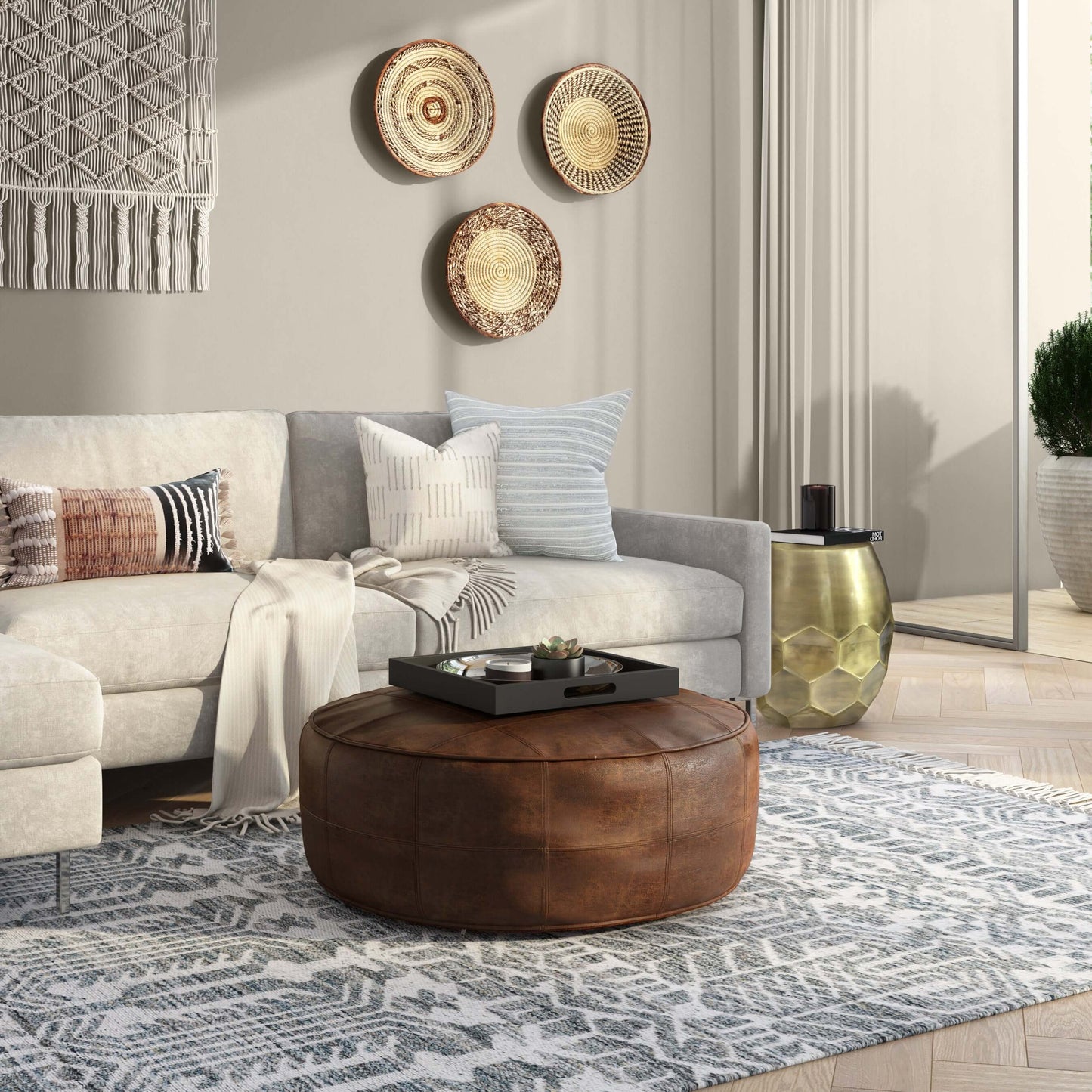 Connor Brown Buffalo Leather Ottoman 34" – Round Top-Grain Leather Pouf in a stylish living room setting