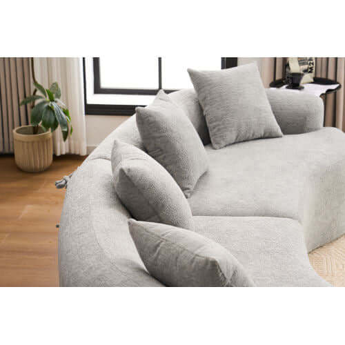 Curved Compression Foam Sectional Sofa – 110” Modular Chenille Couch (Sleeper Style) with soft gray upholstery and pillows.