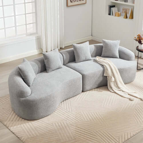Curved Compression Foam Sectional Sofa – 110” Modular Chenille Couch (Sleeper Style) in soft gray upholstery with pillows.
