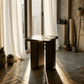 Dana Natural Marble Top & Dark Walnut End Table w/Natural Marble in a sunlit room with curtains
