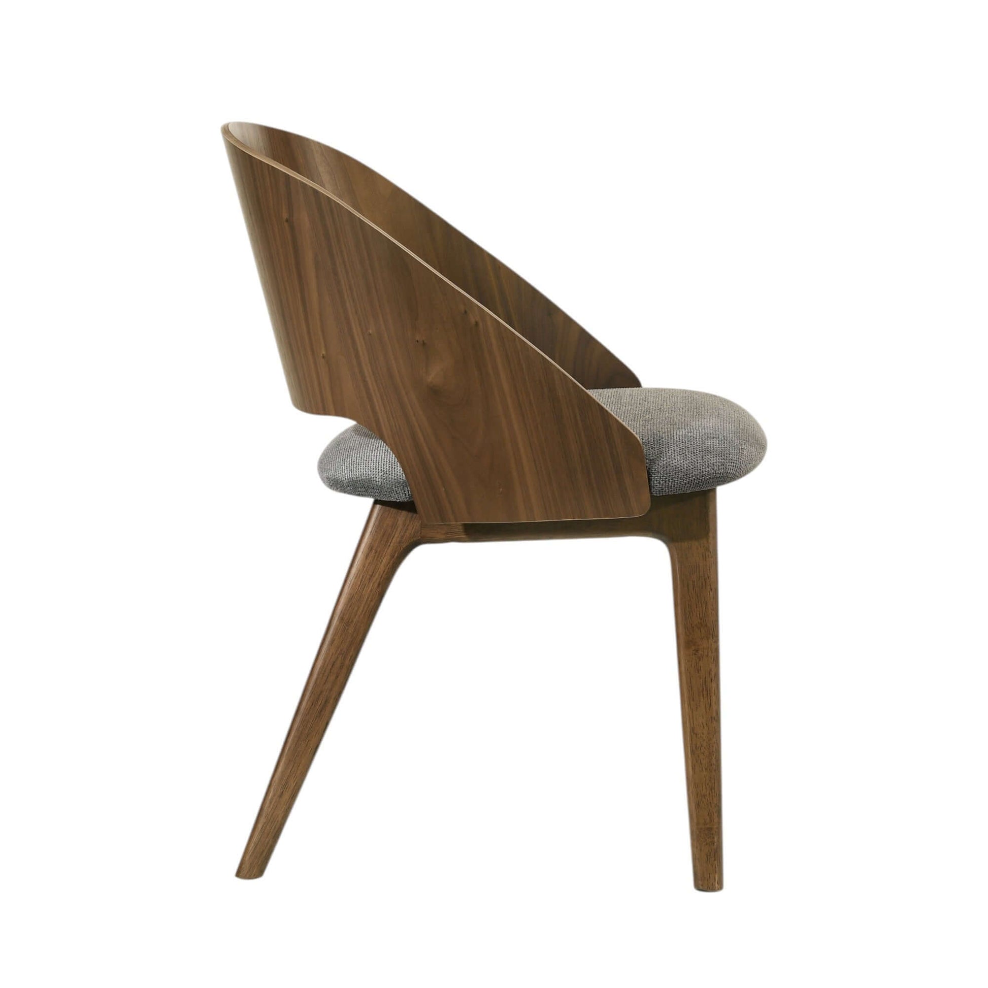 Delmon Fabric & Dark Walnut Side Chair (Set of 2) in side view, featuring soft upholstery and a curved back.