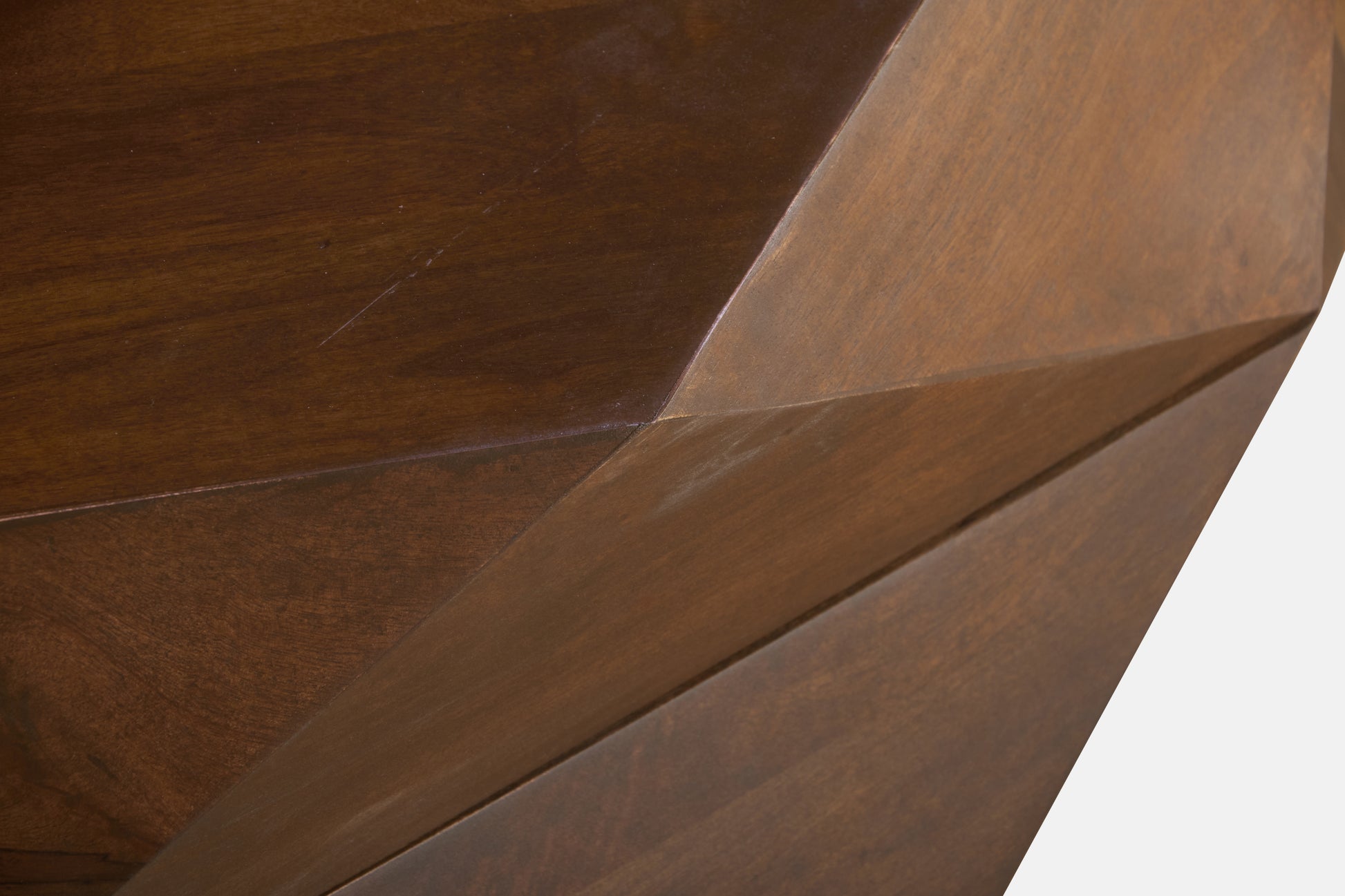 Close-up of the Diamond Shape Solid Wood Lift-Top Coffee Table in Matte Brown 48" surface showcasing facets.
