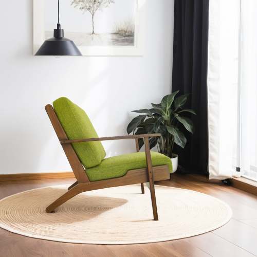 Connor Solid Wood Linen Armchair – Mid-Century Modern Lounge Chair (4 Colors) in green upholstery beside a plant.