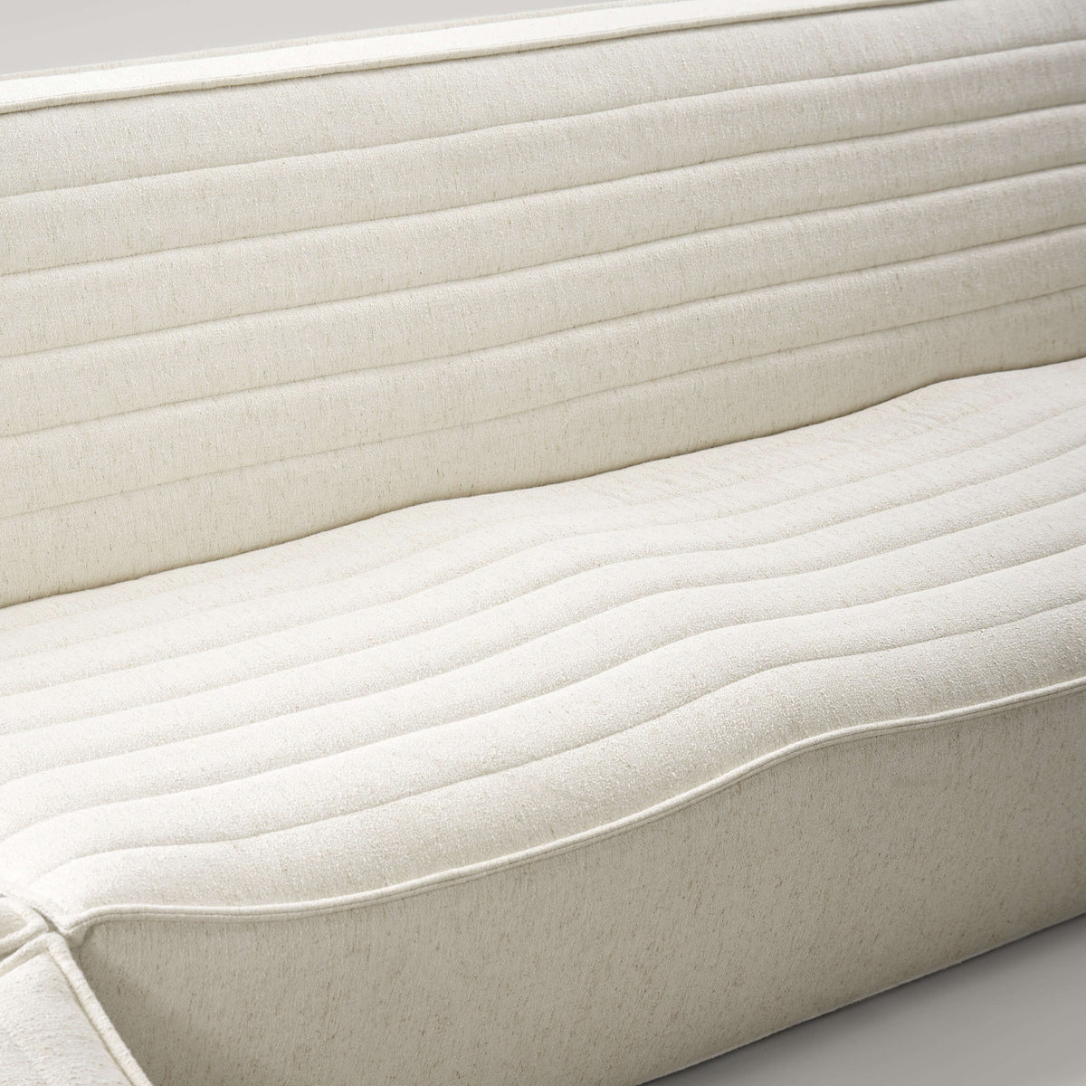 Close-up of the soft, breathable fabric of the Evelyn Harmony Corner Sofa's comfortable backrest.
