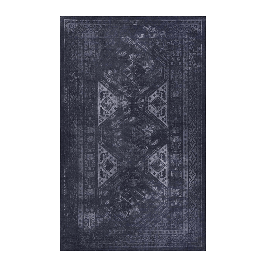 Black and gray patterned rectangular area rug, featuring intricate designs and a stylish modern look.