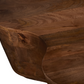 Close-up of Free Form Solid Wood Premium Coffee Table showcasing unique curved design and rich brown color.