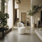 Hollis Beige Boucle Accent Chair (Set of 2) in a stylish, modern living room setting with plants and natural light.