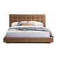 Hudson leather upholstered queen platform bed frame with biscuit-tufted headboard in tan.