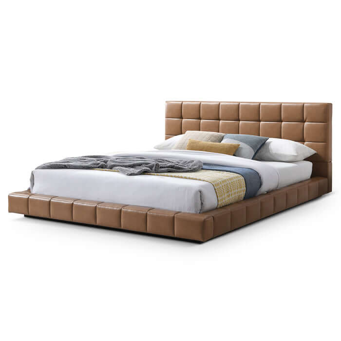 Hudson leather upholstered queen platform bed frame with biscuit-tufted headboard in tan.