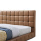 Hudson leather upholstered queen platform bed frame with biscuit-tufted headboard in tan.