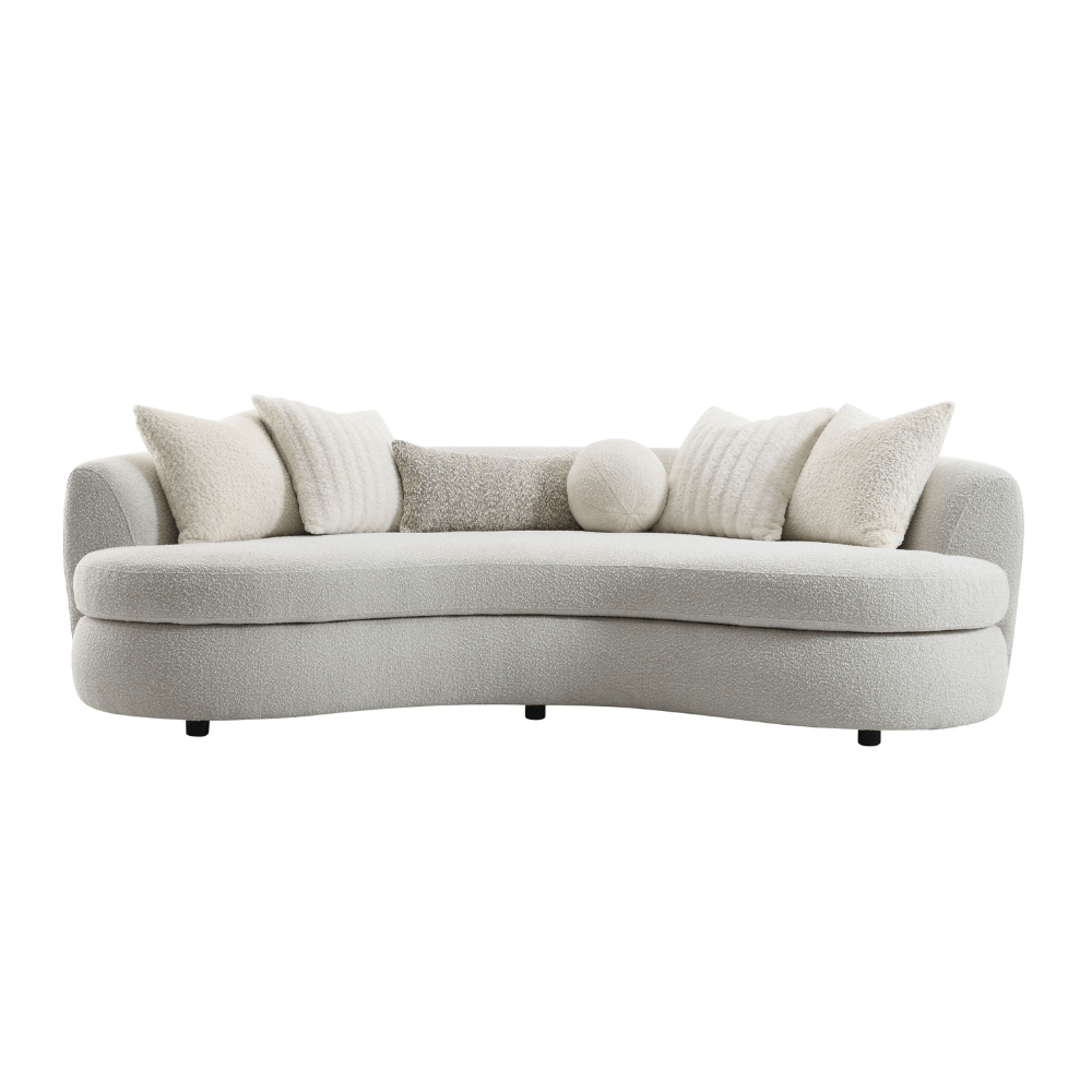 Iniko Bouclé Sofa – 105” Beige Curved Sofa with 6 Pillows (Modern Statement Couch) on a white background.