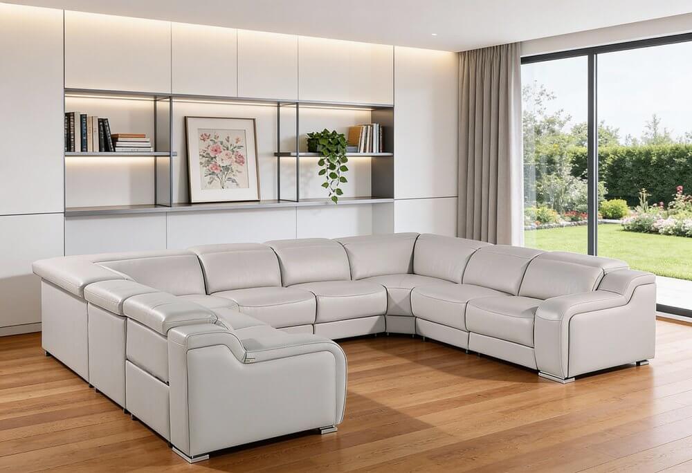 Light Gray Italian Leather Power Reclining U Shaped Eight Piece Corner Sectional With Console in modern living space.