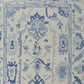 Ivory and Blue Wool Floral Hand Knotted Area Rug With Fringe Area Rug | 9' x 13' detailed pattern in soft blue tones.