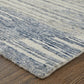 Ivory Blue And Silver Abstract Hand Knotted Distressed Area Rug | 9' x 13' on wooden floor with abstract pattern.