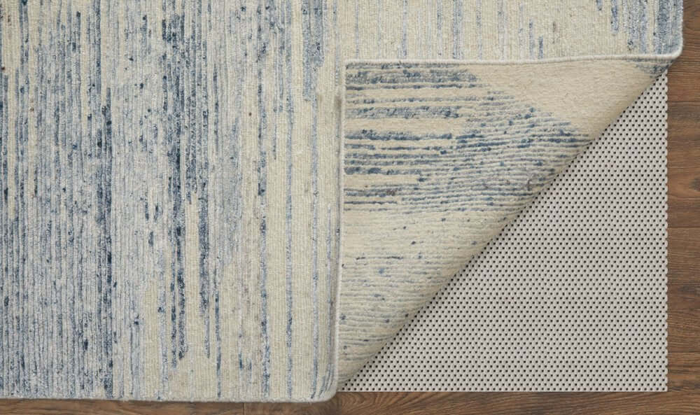 Ivory Blue And Silver Abstract Hand Knotted Distressed Area Rug | 9' x 13', showcasing its reverse side and texture.