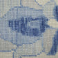Close-up texture of Ivory and Blue Wool Floral Hand Knotted Area Rug With Fringe Area Rug | 9' x 13' in blue and ivory.