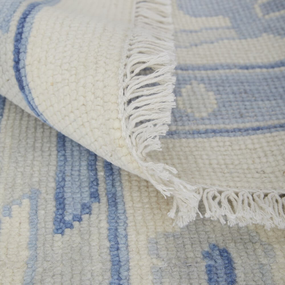 Ivory and Blue Wool Floral Hand Knotted Area Rug With Fringe Area Rug | 9' x 13' showcasing detail and texture.