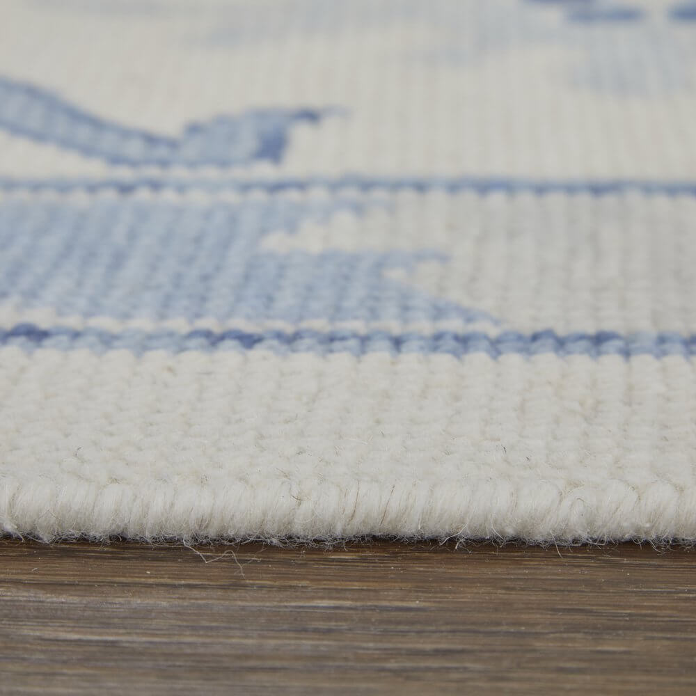 Ivory and Blue Wool Floral Hand Knotted Area Rug With Fringe Area Rug | 9' x 13'. Close-up detail of soft wool texture.