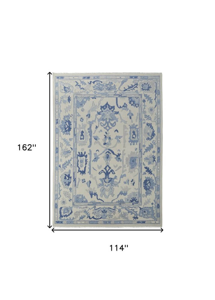 Ivory and Blue Wool Floral Hand Knotted Area Rug With Fringe Area Rug | 9' x 13' displayed with dimensions 114" x 162".