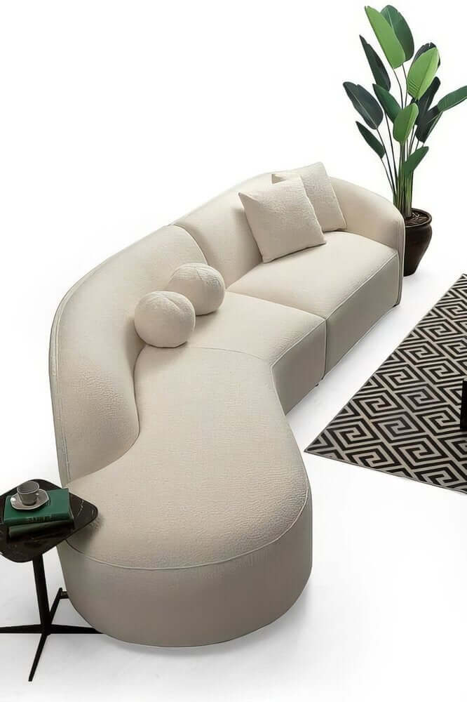 Ivory Boucle Curved Modular Sectional Sofa with Chaise & Toss Pillows | Modern 2-Piece Sectional in a cozy living room setting.