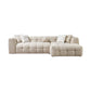 Ivory Boucle L Shaped Two Piece Sofa and Chaise Sectional With Toss Pillows in a cozy living room setting.
