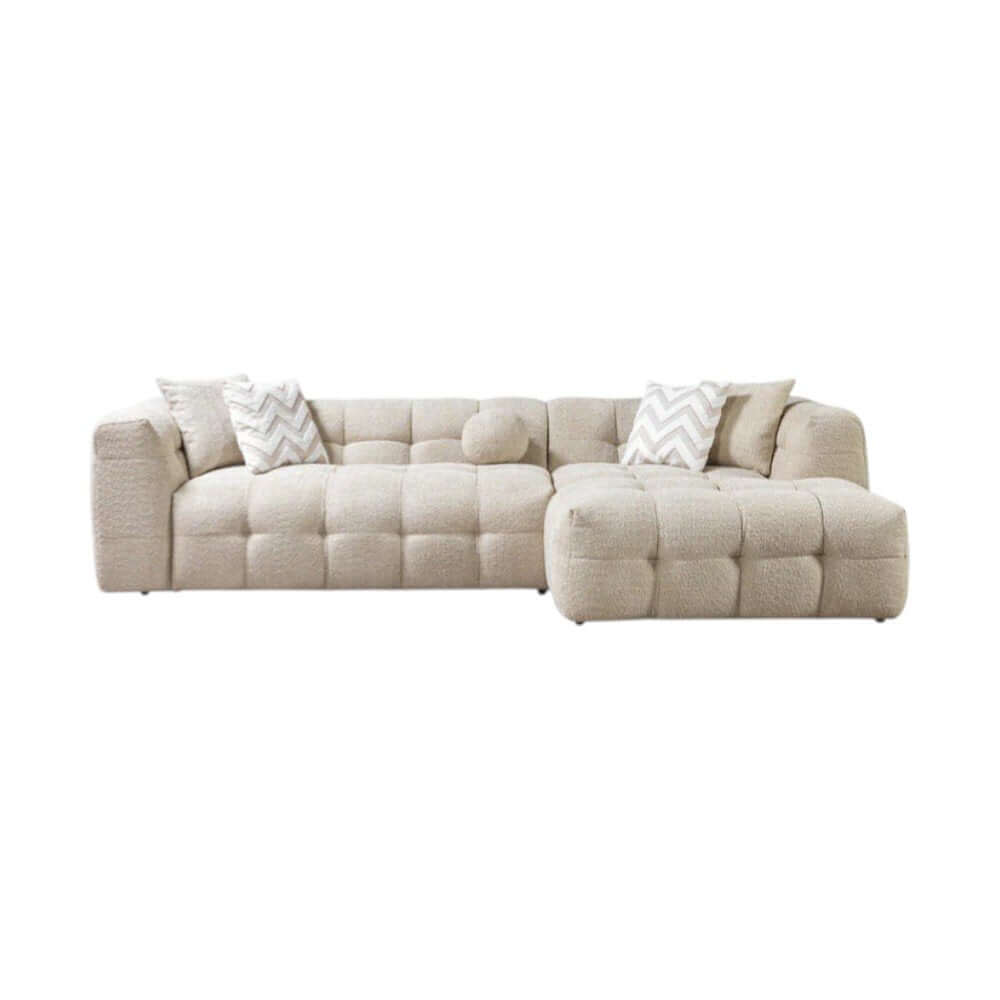 Ivory Boucle L Shaped Two Piece Sofa and Chaise Sectional With Toss Pillows in a cozy living room setting.