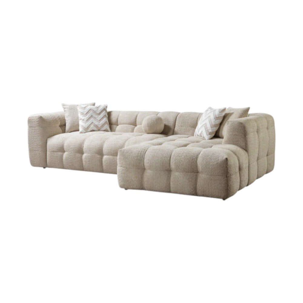 Ivory Boucle L Shaped Two Piece Sofa and Chaise Sectional With Toss Pillows in a cozy living room setting.