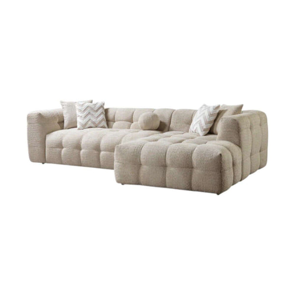 Ivory Boucle L Shaped Two Piece Sofa and Chaise Sectional With Toss Pillows in a cozy living room setting.
