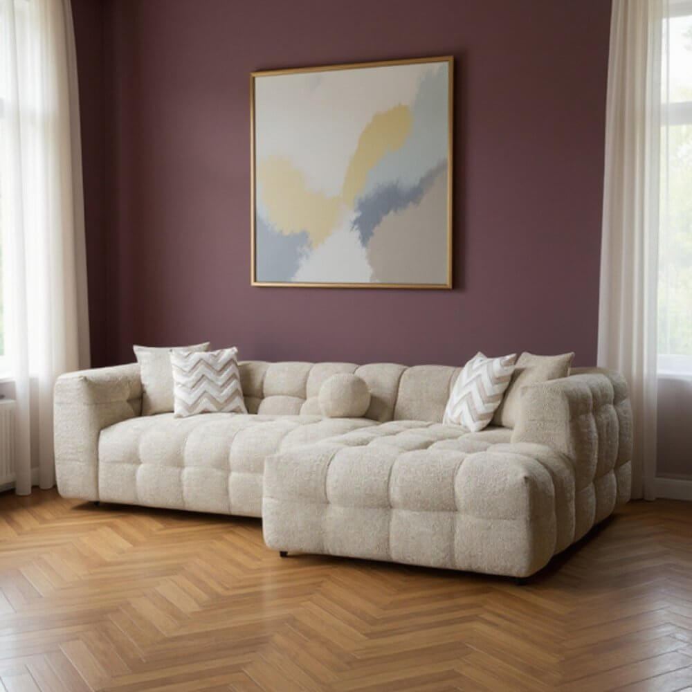 Ivory Boucle L Shaped Two Piece Sofa and Chaise Sectional With Toss Pillows in a modern living room setting.