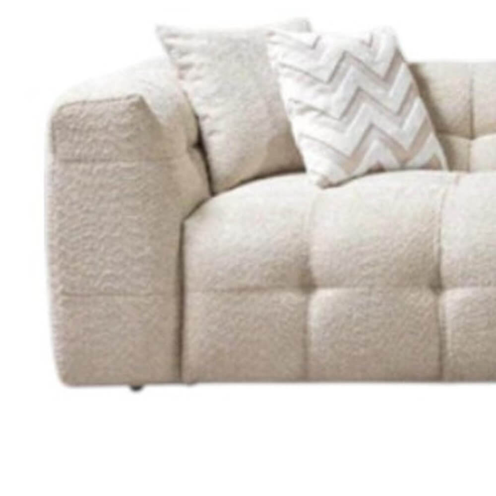 Ivory Boucle L Shaped Two Piece Sofa and Chaise Sectional With Toss Pillows close-up view featuring soft upholstery