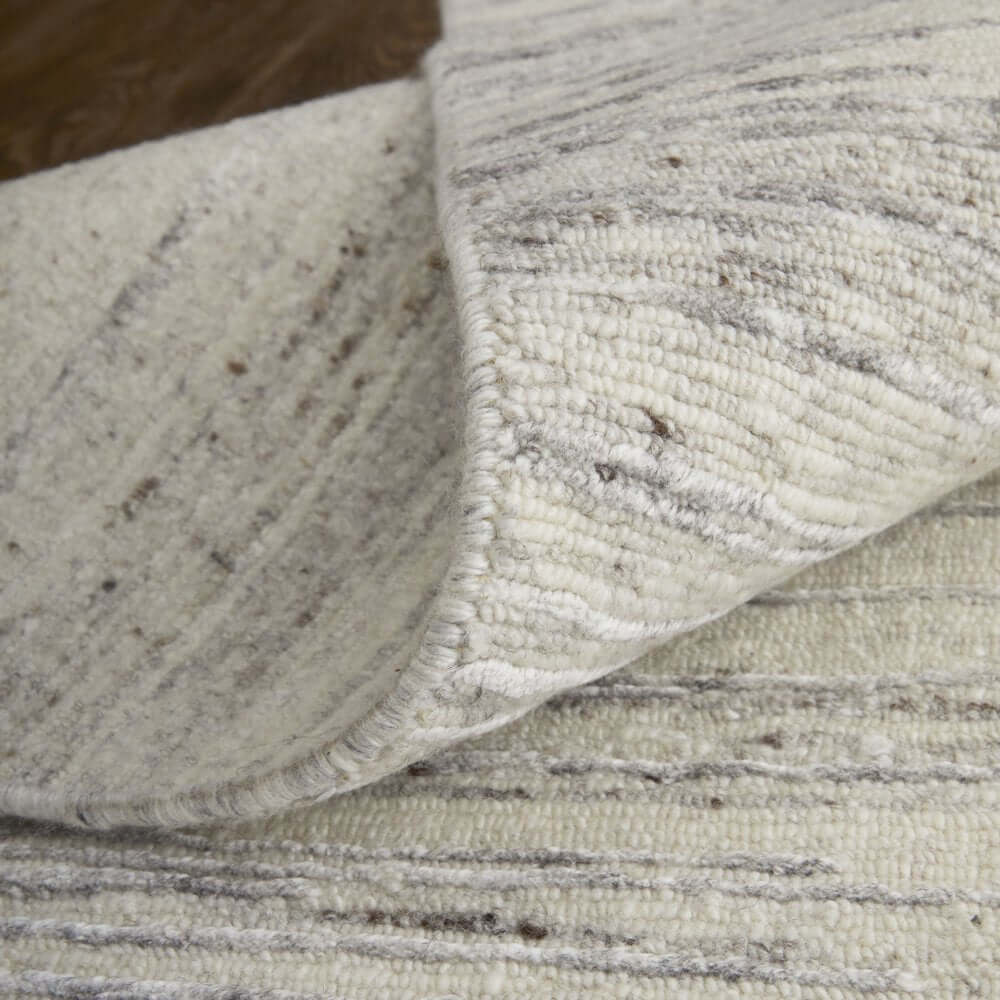 9' X 13' Ivory And Gray Abstract Hand Knotted Distressed Area Rug showing unique texture and design.