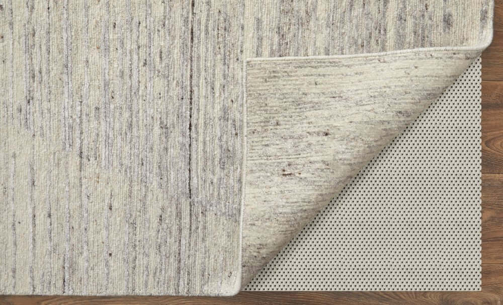 9' X 13' Ivory And Gray Abstract Hand Knotted Distressed Area Rug showcasing its detailed texture and backing.