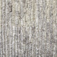 9' X 13' Ivory And Gray Abstract Hand Knotted Distressed Area Rug texture close-up.