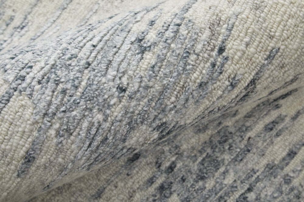 Ivory Gray and Blue Abstract Hand Knotted Worn Faded Area Rug | 9' x 13' close-up showing texture and design.