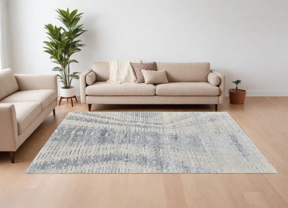Ivory Gray and Blue Abstract Hand Knotted Worn Faded Area Rug | 9' x 13' in a modern living room setting.