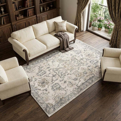 Ivory And Gray Floral Medallion Distressed Area Rug | 9' x 13'. Elegant rug in a cozy living room setting.