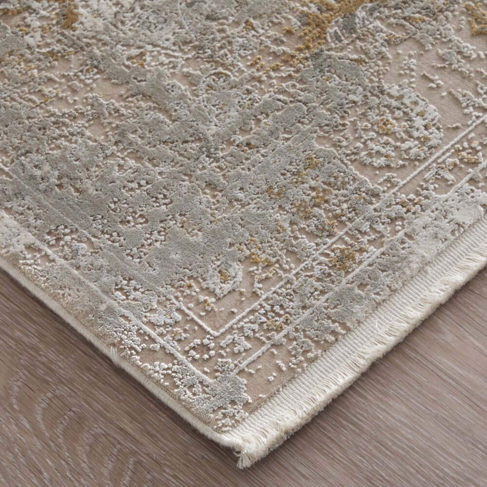 Ivory Gray And Gold Floral Area Rug With Fringe Area Rug | 9' x 13' close-up showing texture and fringe detail.