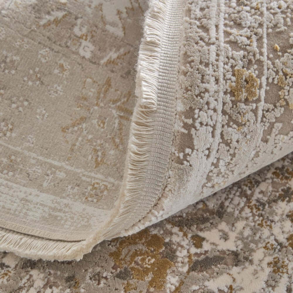 Ivory Gray And Gold Floral Area Rug With Fringe Area Rug | 9' x 13' close-up of texture and fringe details.