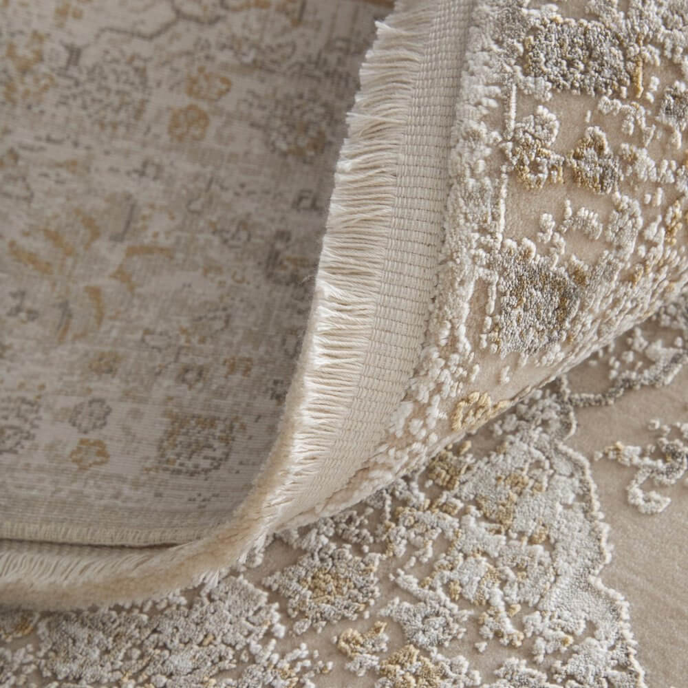Ivory Gray And Gold Oriental Area Rug With Fringe Area Rug | 9' x 13' showing rich texture and detailed design.