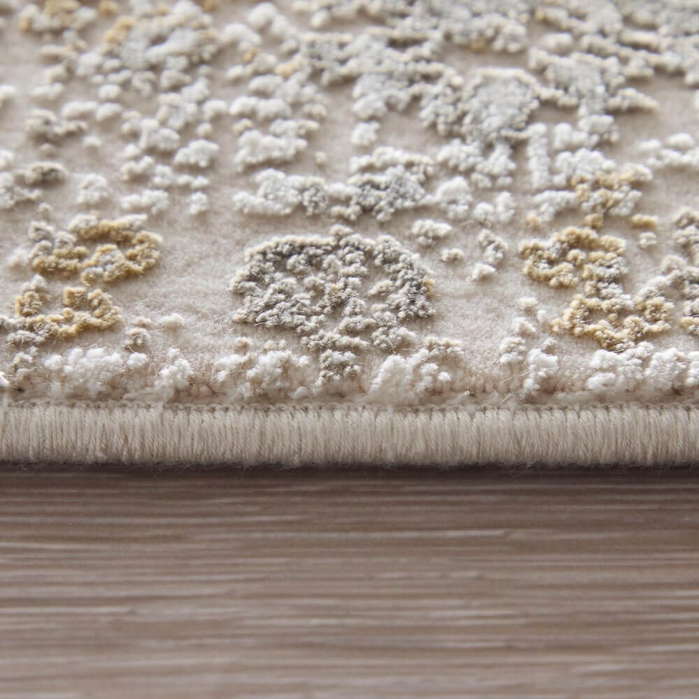 Ivory Gray And Gold Oriental Area Rug With Fringe Area Rug | 9' x 13' close-up texture and fringe detail.