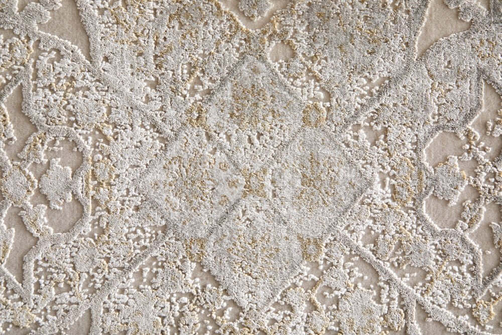 Ivory Gray And Gold Oriental Area Rug With Fringe Area Rug | 9' x 13'. Close-up of intricate pattern and texture.