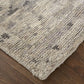 Ivory And Gray Wool Abstract Hand Knotted Area Rug | 9' x 13' on wooden floor, showcasing its texture and color.